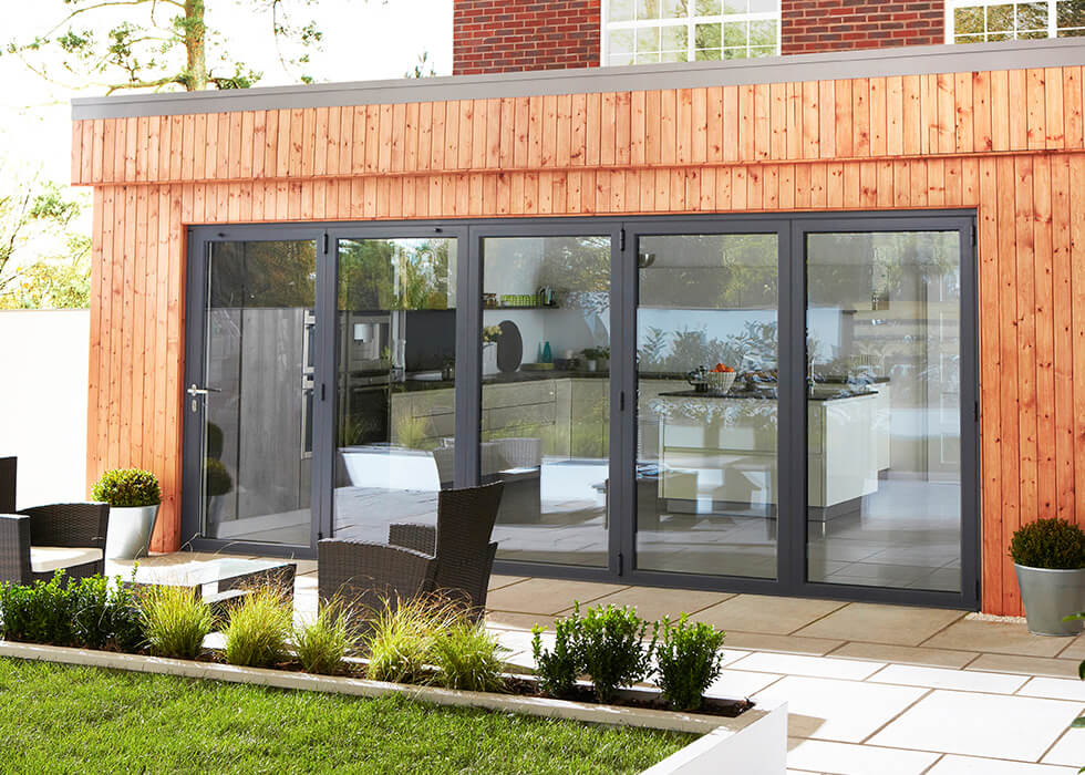 https://stedek.icaal.dev/wp-content/uploads/2018/04/Extension-black-aluminium-bifold-door.jpg