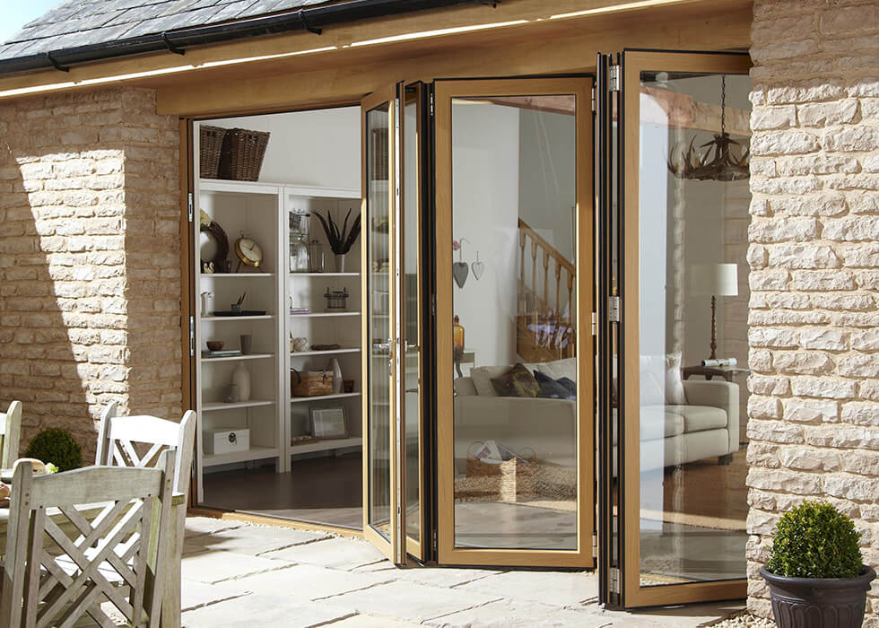 https://stedek.icaal.dev/wp-content/uploads/2018/04/Oak-effect-aluminium-bifold-door.jpg